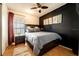 Bedroom with dark-colored accent wall and ceiling fan at 1413 La Paloma Cir, Winter Springs, FL 32708