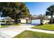 Front view of charming house with garage at 1413 La Paloma Cir, Winter Springs, FL 32708