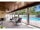 Enclosed lanai featuring outdoor seating and views of the private pool at 1413 La Paloma Cir, Winter Springs, FL 32708