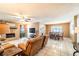 Large open living room with stone fireplace and view of the dining room at 1413 La Paloma Cir, Winter Springs, FL 32708