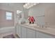 Bathroom with double vanity and bathtub at 1908 S Farm Rd, Deland, FL 32720
