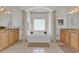 Bathroom boasts a large soaking tub, double sinks, and a view at 1908 S Farm Rd, Deland, FL 32720