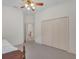 Bedroom with bed, closet and access to hall at 1908 S Farm Rd, Deland, FL 32720