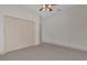 Bedroom with double doors and carpet at 1908 S Farm Rd, Deland, FL 32720