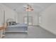 Spacious primary bedroom with a post bed and access to backyard at 1908 S Farm Rd, Deland, FL 32720