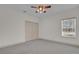 Bedroom with window, closet and carpet at 1908 S Farm Rd, Deland, FL 32720