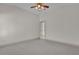 Bedroom with door to hallway and carpet at 1908 S Farm Rd, Deland, FL 32720