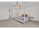 Bright bedroom with a post bed and ceiling fan at 1908 S Farm Rd, Deland, FL 32720