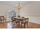 Formal dining room featuring a chandelier and wood table at 1908 S Farm Rd, Deland, FL 32720