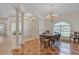 Elegant dining room with wood floors and chandelier at 1908 S Farm Rd, Deland, FL 32720