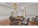 Formal dining room with chandelier and tiled floor at 1908 S Farm Rd, Deland, FL 32720