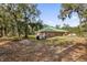 Brick house exterior with green roof and large backyard at 1908 S Farm Rd, Deland, FL 32720
