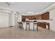 Kitchen with breakfast bar, island, dark wood cabinets, and tile floors at 1908 S Farm Rd, Deland, FL 32720