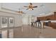 Kitchen with island, breakfast bar, dark wood cabinets and tile flooring at 1908 S Farm Rd, Deland, FL 32720