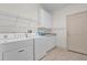 Laundry room with washer, dryer and cabinets at 1908 S Farm Rd, Deland, FL 32720