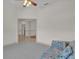 Spacious living room with a view into another room and a floral couch at 1908 S Farm Rd, Deland, FL 32720