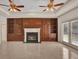 Living room with fireplace, built-in shelving, and French doors at 1908 S Farm Rd, Deland, FL 32720