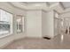 Spacious living room with large windows and tiled floors at 1908 S Farm Rd, Deland, FL 32720