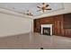 Living room with fireplace and built-in wooden shelving at 1908 S Farm Rd, Deland, FL 32720