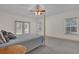 Main bedroom with king bed and French doors at 1908 S Farm Rd, Deland, FL 32720