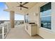 Spacious balcony with ocean view, built-in grill, and ceiling fan at 1925 S Atlantic Ave # 703, Daytona Beach, FL 32118