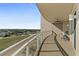 Covered balcony with seating area and city views at 1925 S Atlantic Ave # 703, Daytona Beach, FL 32118