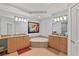 Large bathroom with double vanity, soaking tub, and tile floors at 1925 S Atlantic Ave # 703, Daytona Beach, FL 32118