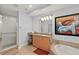 Bathroom with walk-in shower, double vanity, and soaking tub at 1925 S Atlantic Ave # 703, Daytona Beach, FL 32118