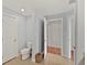 Guest bathroom with toilet and flooring at 1925 S Atlantic Ave # 703, Daytona Beach, FL 32118
