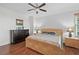Bright bedroom with wood floors, large bed, and ample storage at 1925 S Atlantic Ave # 703, Daytona Beach, FL 32118