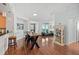 Open concept dining area with hardwood floors and kitchen at 1925 S Atlantic Ave # 703, Daytona Beach, FL 32118