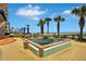 Tranquil outdoor fountain with palm trees and ocean view at 1925 S Atlantic Ave # 703, Daytona Beach, FL 32118