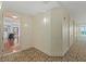 Building hallway with carpet, access to unit, and views of nearby rooms at 1925 S Atlantic Ave # 703, Daytona Beach, FL 32118