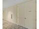 Building hallway with carpet and storage access at 1925 S Atlantic Ave # 703, Daytona Beach, FL 32118