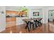 Modern kitchen with light wood cabinets, granite counters, and stainless steel appliances at 1925 S Atlantic Ave # 703, Daytona Beach, FL 32118