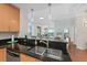Modern kitchen with double sink, granite counters & stainless steel appliances at 1925 S Atlantic Ave # 703, Daytona Beach, FL 32118