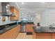 Modern kitchen with stainless steel appliances and a large island at 1925 S Atlantic Ave # 703, Daytona Beach, FL 32118
