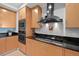 Modern kitchen with stainless steel appliances and granite countertops at 1925 S Atlantic Ave # 703, Daytona Beach, FL 32118