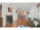 Open living room with fireplace and kitchen view at 1925 S Atlantic Ave # 703, Daytona Beach, FL 32118