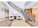 Elegant lobby with staircase, plush chairs, and modern decor at 1925 S Atlantic Ave # 703, Daytona Beach, FL 32118