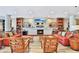 Relaxing lounge with fireplace, comfortable seating, and built-in shelves at 1925 S Atlantic Ave # 703, Daytona Beach, FL 32118