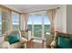 Cozy sitting area with ocean view and balcony access at 1925 S Atlantic Ave # 703, Daytona Beach, FL 32118
