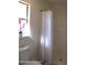Simple bathroom with shower/tub combo and window at 222 Oak Branch Dr, Edgewater, FL 32141