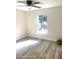 Bright bedroom with large window and ceiling fan at 222 Oak Branch Dr, Edgewater, FL 32141
