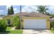 Single-story house with attached garage and landscaped yard at 222 Oak Branch Dr, Edgewater, FL 32141