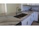 Modern kitchen features granite countertops and stainless steel appliances at 222 Oak Branch Dr, Edgewater, FL 32141