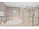 Spa-like bathroom featuring a soaking tub and a separate shower at 231 Riverside Dr # 1001, Holly Hill, FL 32117