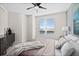 Bright bedroom with a large window and plush bedding at 231 Riverside Dr # 1001, Holly Hill, FL 32117