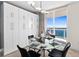 Bright dining area with glass table and bay view at 231 Riverside Dr # 1001, Holly Hill, FL 32117