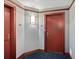 Apartment hallway with two apartment entry doors at 231 Riverside Dr # 1001, Holly Hill, FL 32117